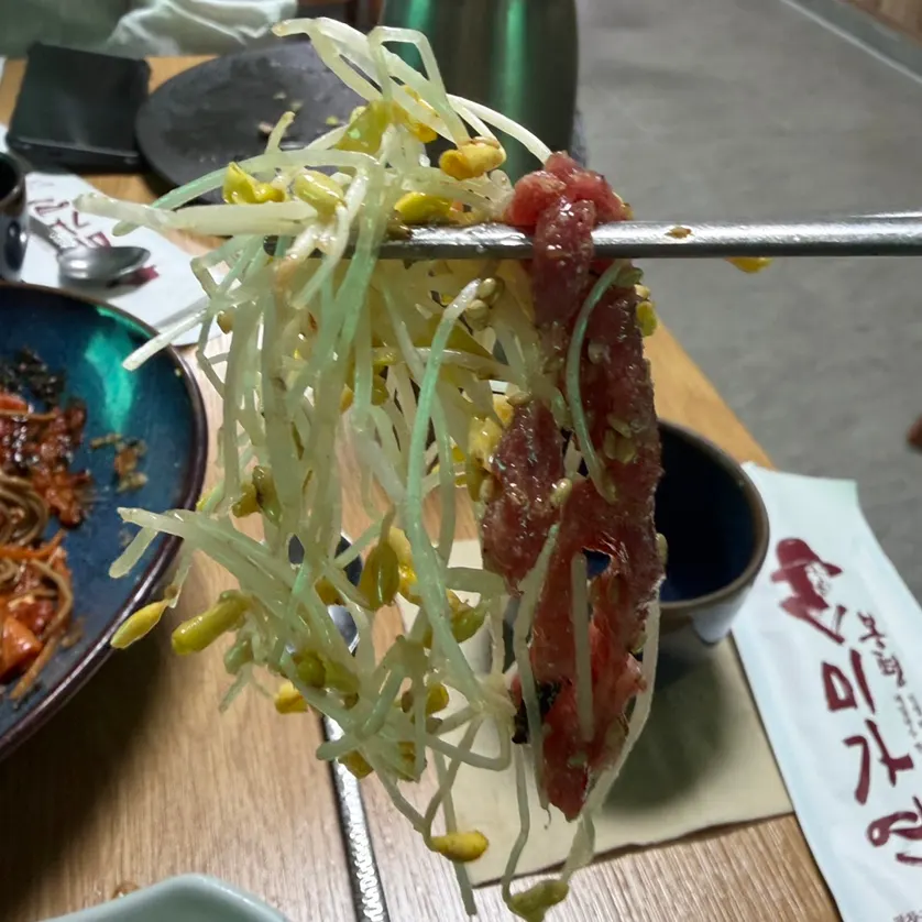 Buckwheat-sprout yukhoe served over noodles