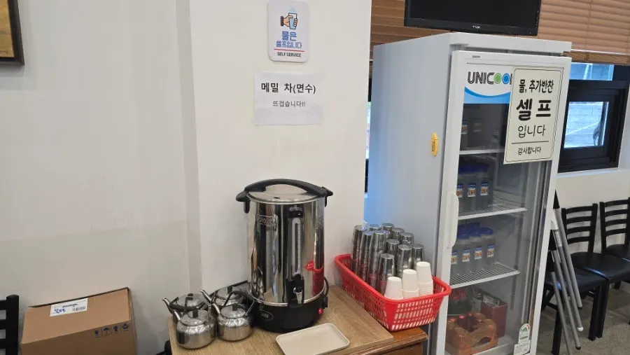 Self-serve station for scooping buckwheat tea (noodle water)