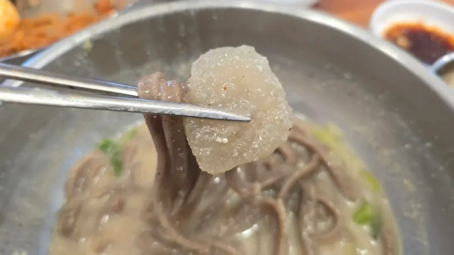 Chewy ongsimi dumplings inside the kalguksu