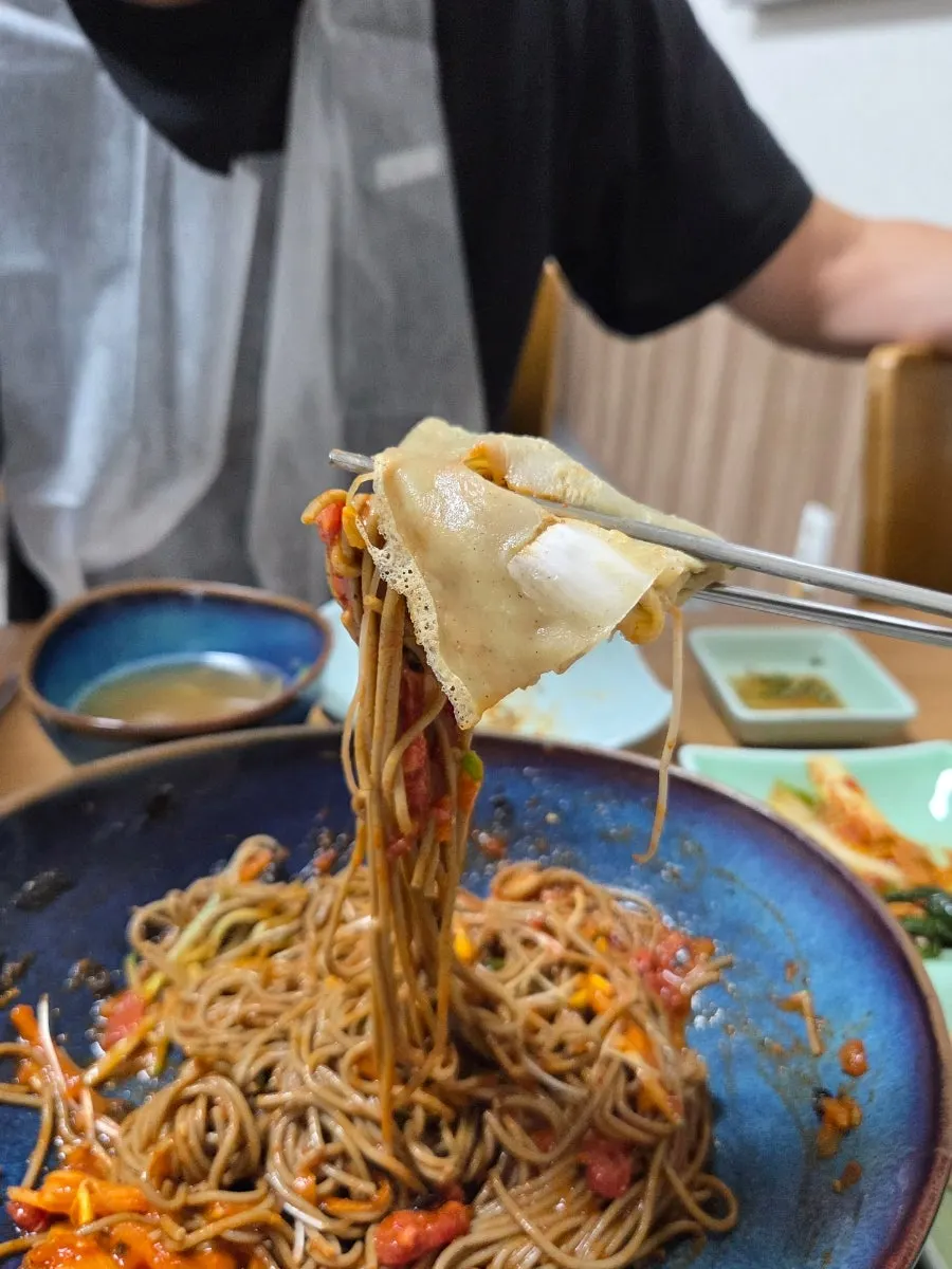 Table with buckwheat noodles and side dishes