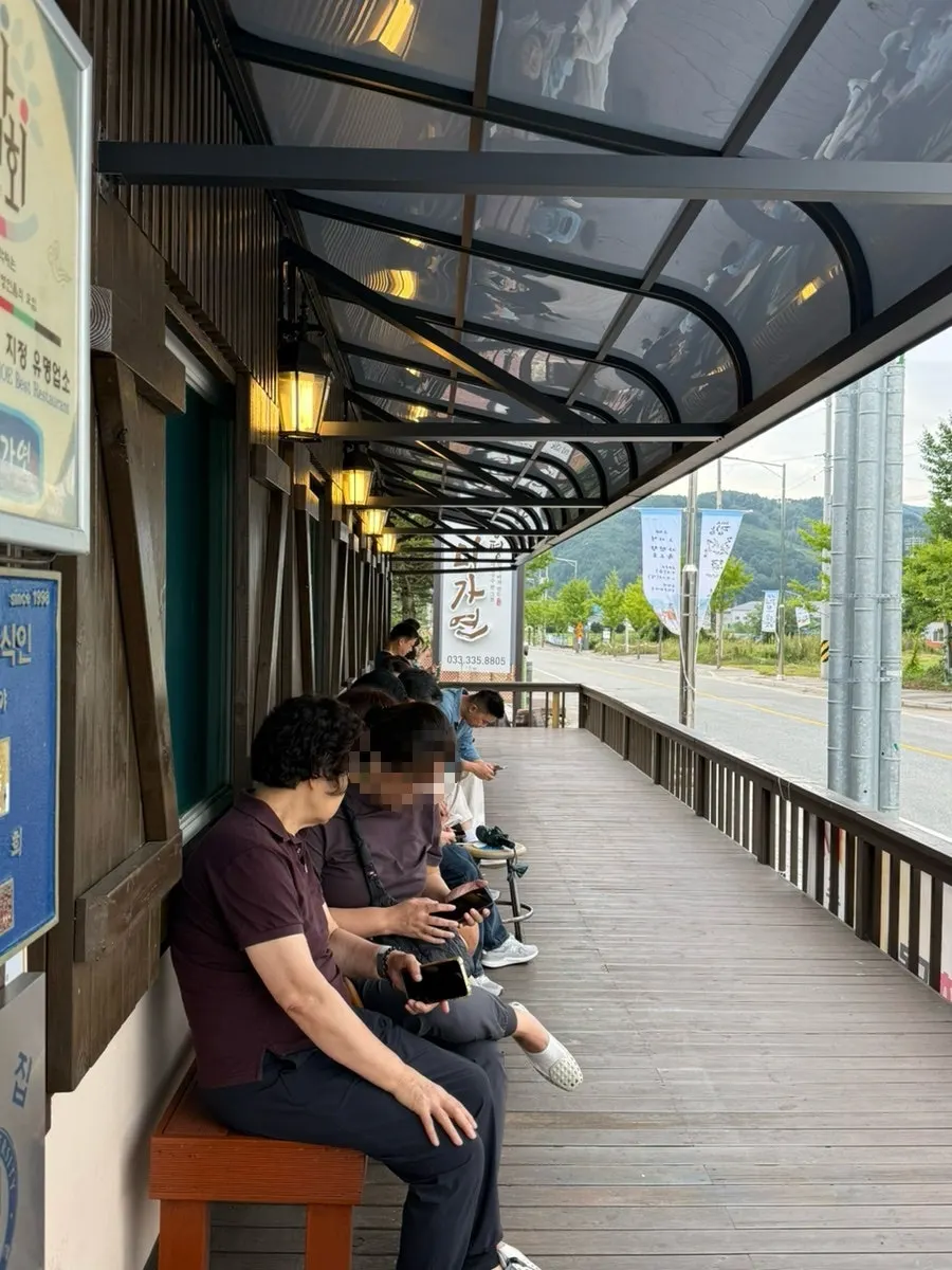 Sign for Bongpyeong Memil Migayeon, a 100% buckwheat noodle restaurant