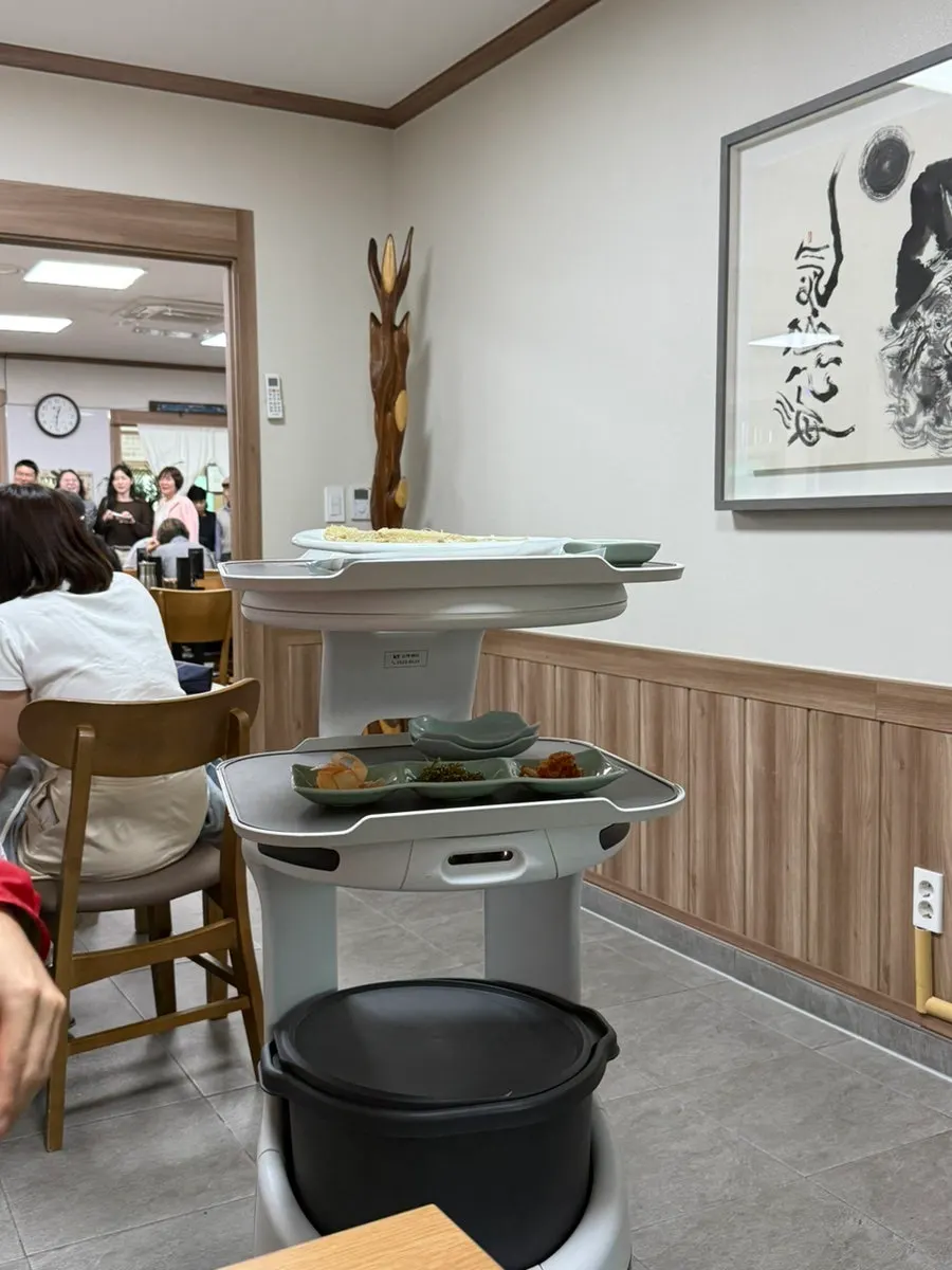Serving robot delivering side dishes and buckwheat pancake