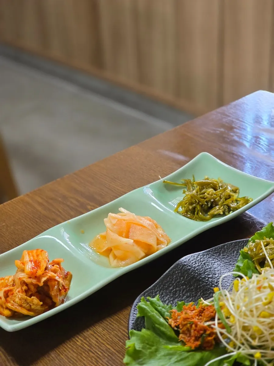 Basic side dishes: kimchi, pickled radish, chopped chili