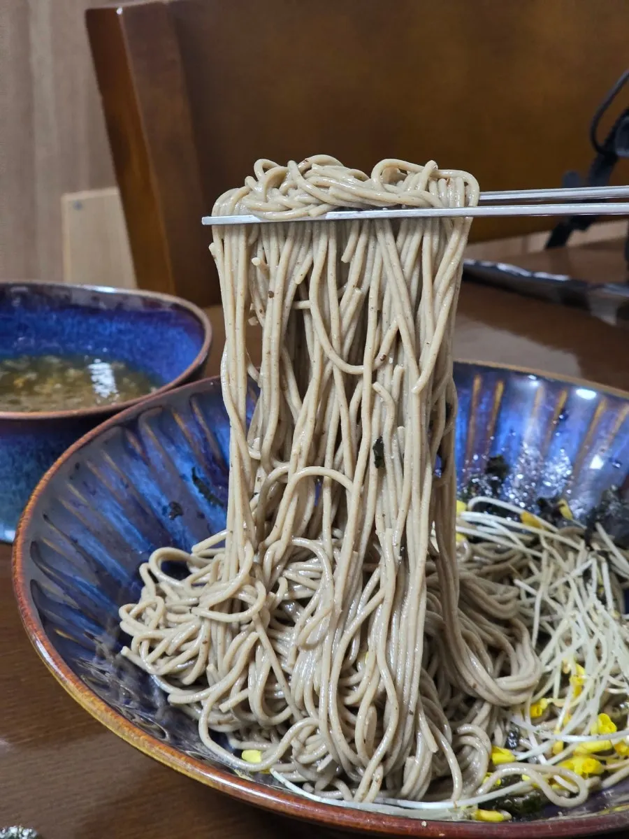 Buckwheat sprouts coated in seaweed flakes and perilla powder