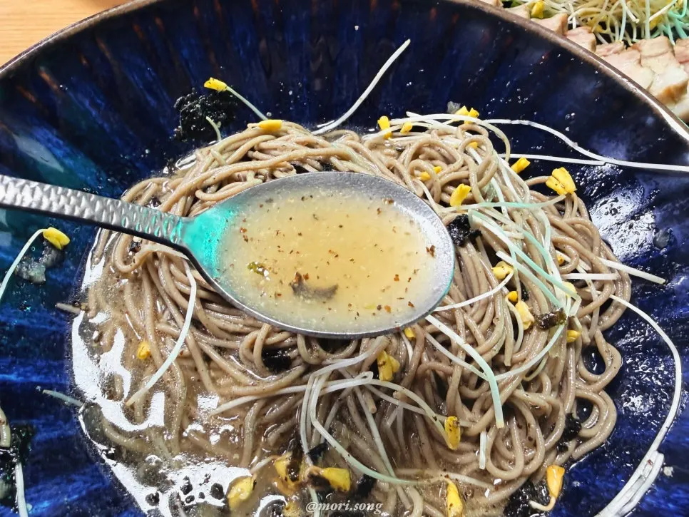 Broth and noodles showcasing the buckwheat flavor