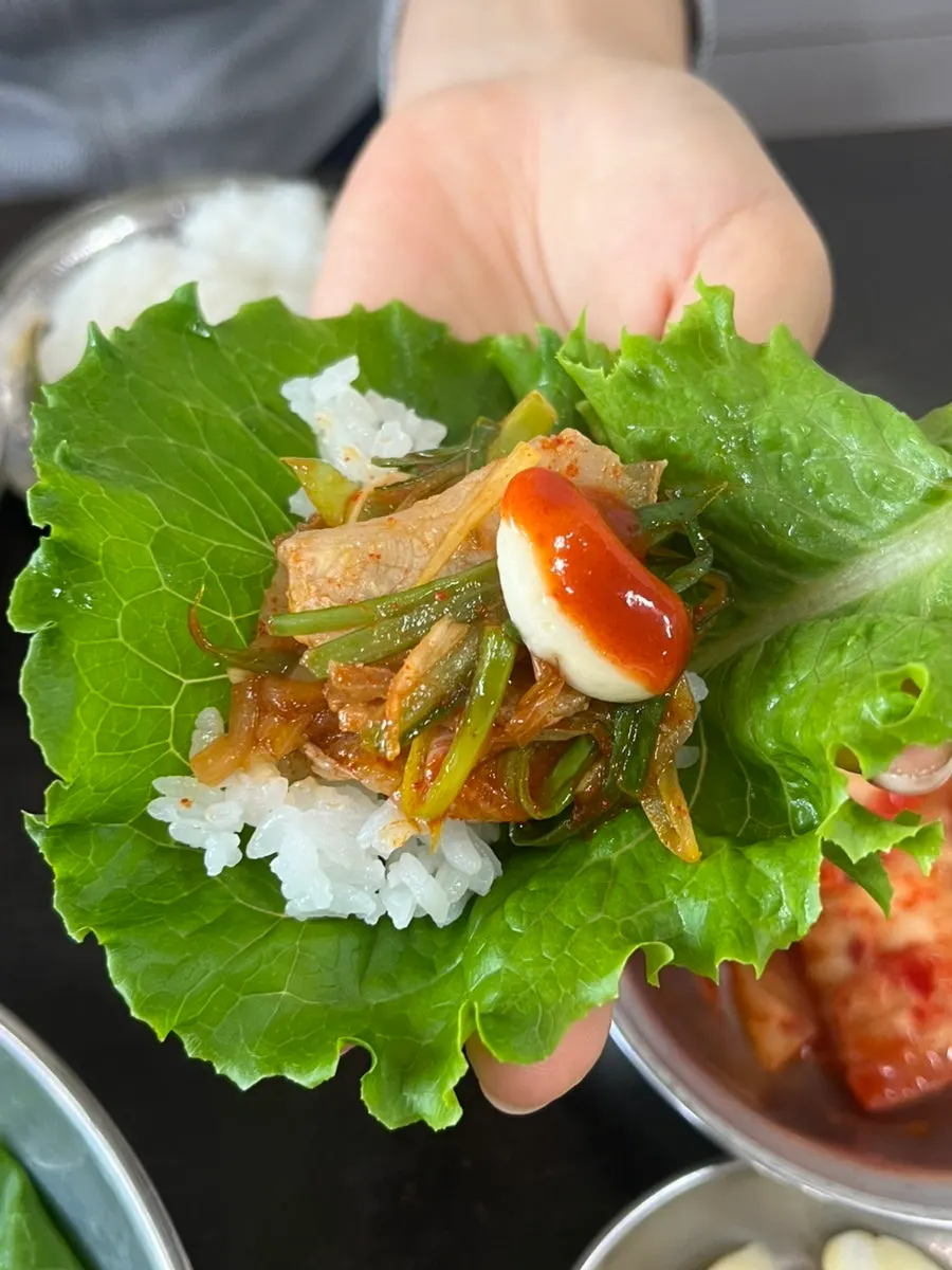 Pajeori piled onto pork belly