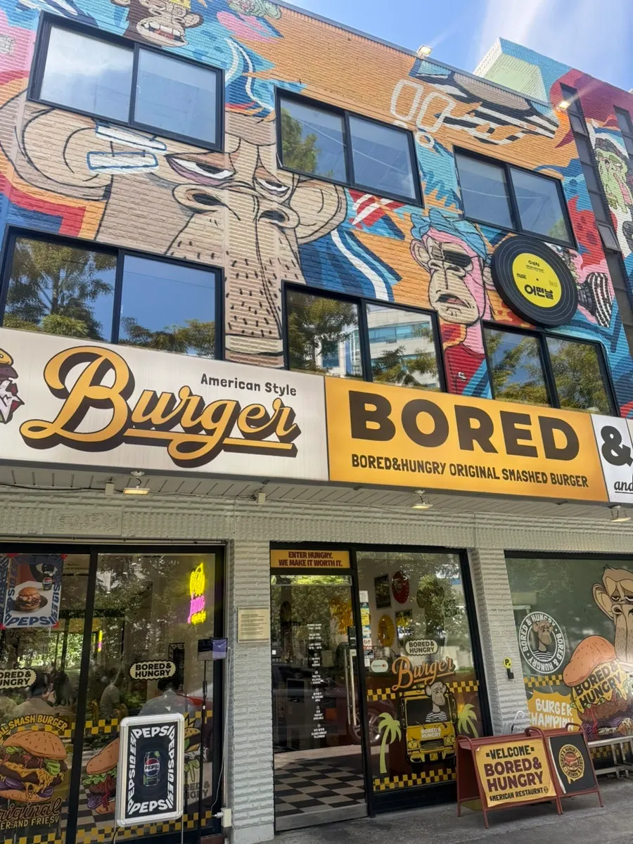 The exterior of Bored & Hungry Mapo with a monkey character graffiti