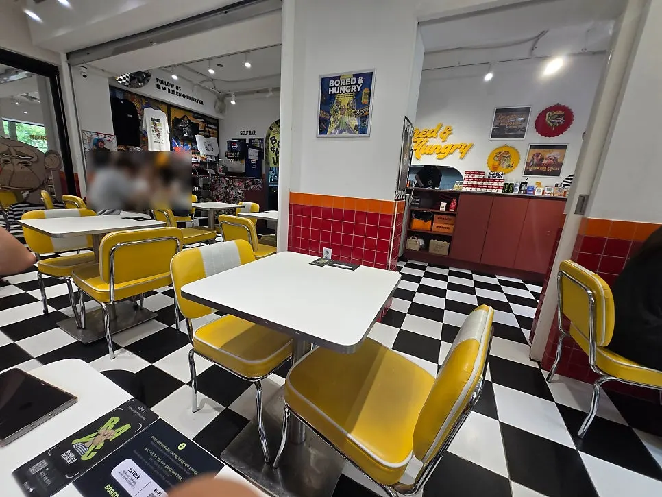 Black-and-white checkered floor and yellow chair seating