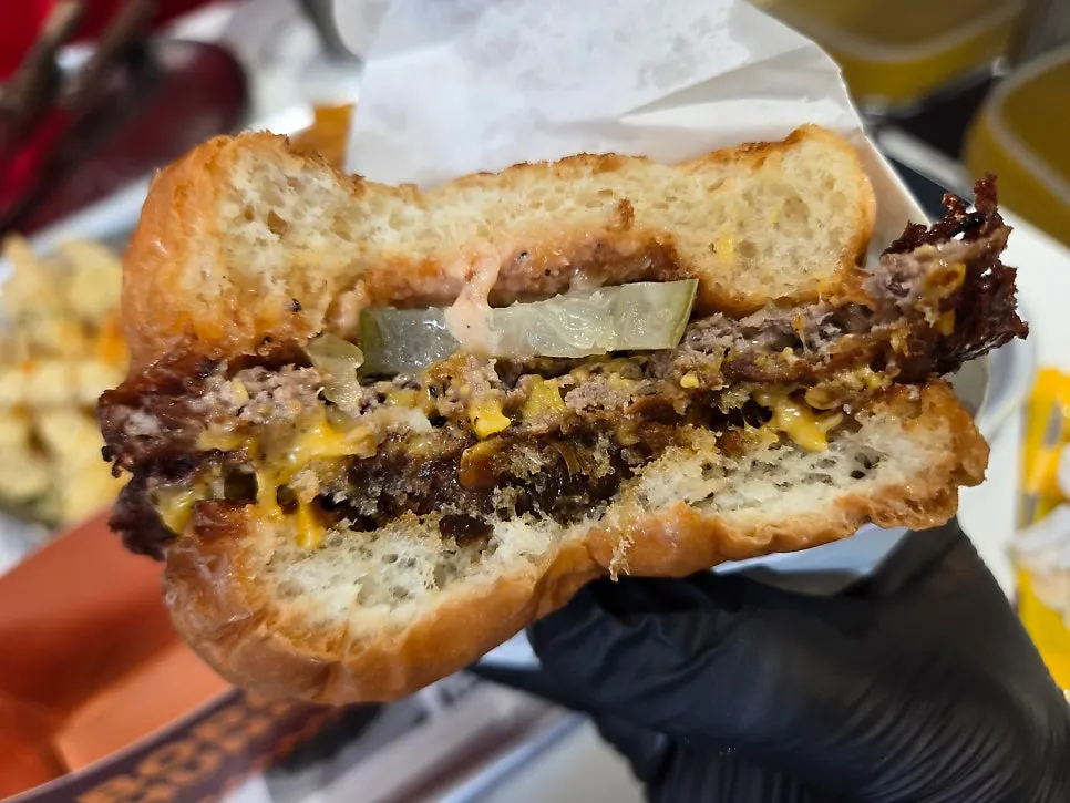 Cross-section of the Champion burger with melted cheese