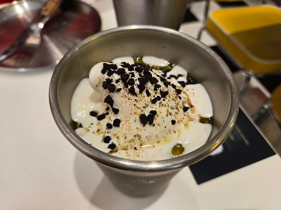 Top of the shake topped with salt, pepper, and olive oil