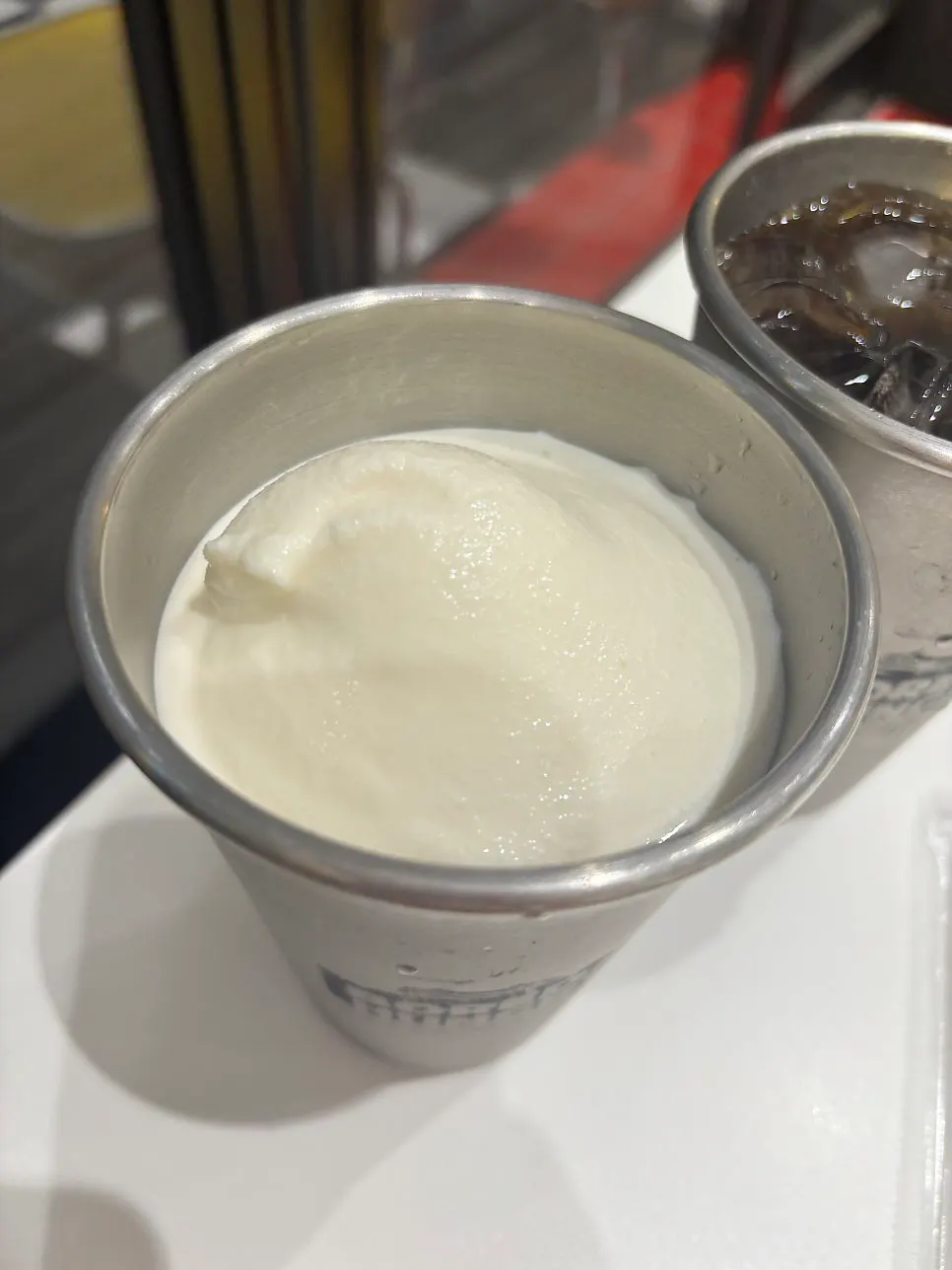 Cup of thick, rich-textured milkshake