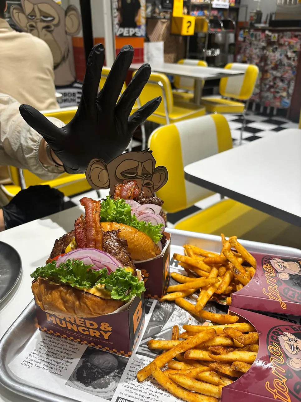 Putting on disposable gloves before eating the burger