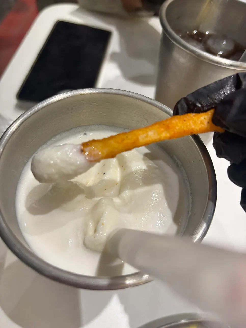 Dipping fries into the milkshake