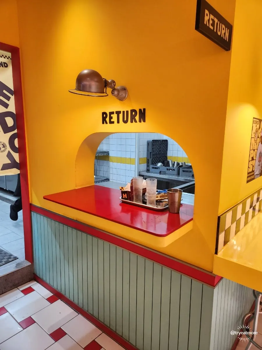 Burger tray liner printed with the brand's story