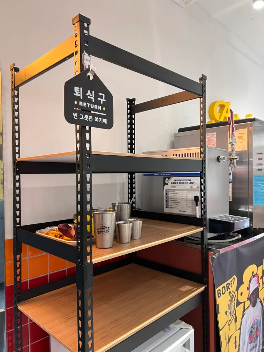Branded merch and self-bar corner inside the store