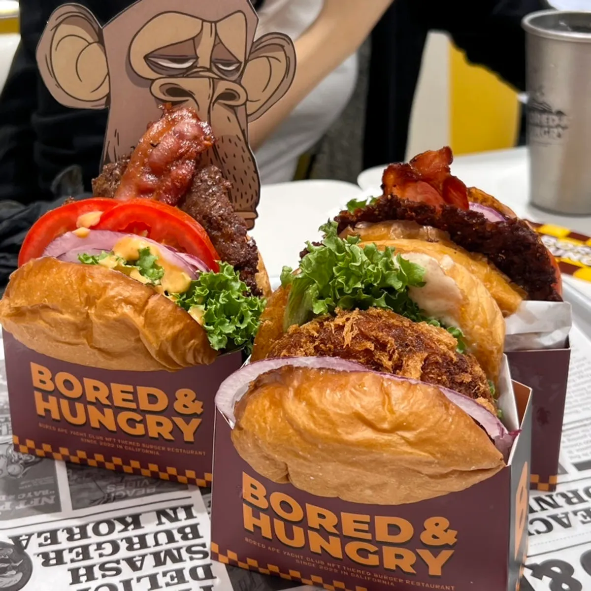 Bacon deluxe burger with the signature monkey pick