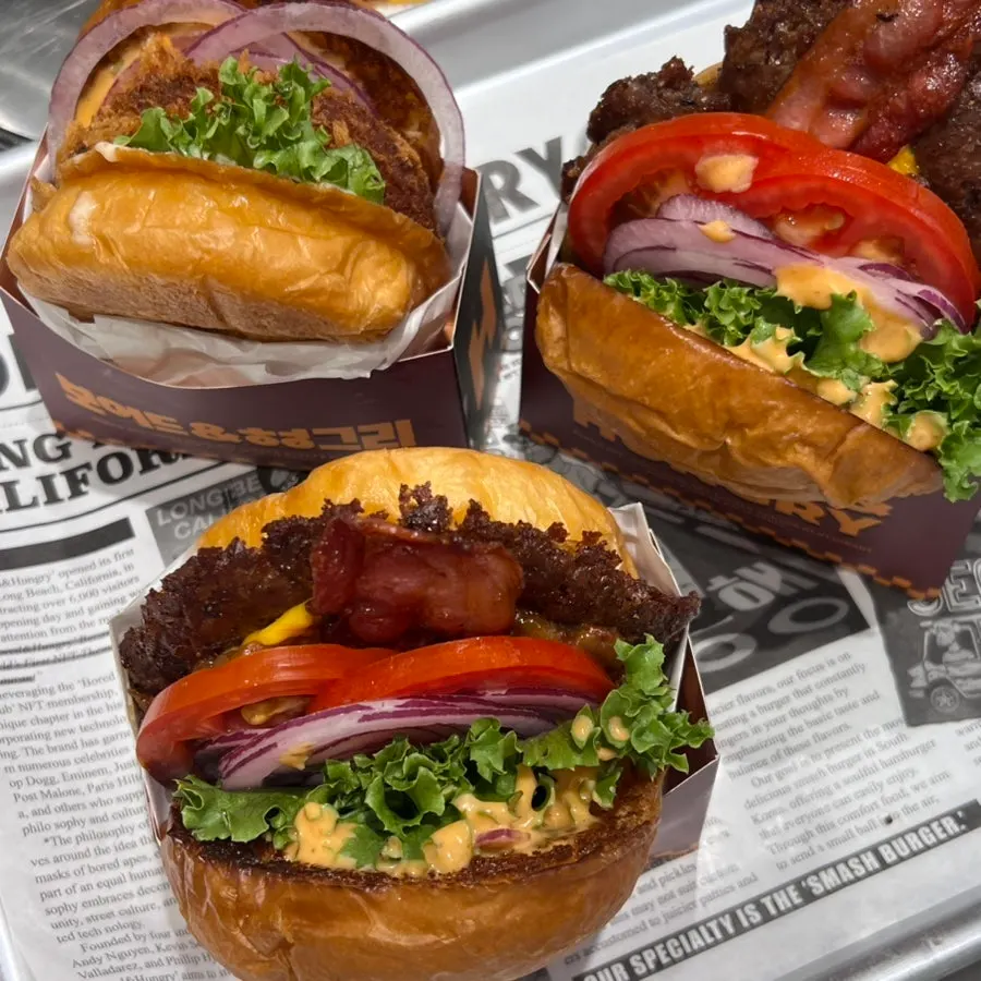 A bitten-into bacon deluxe burger