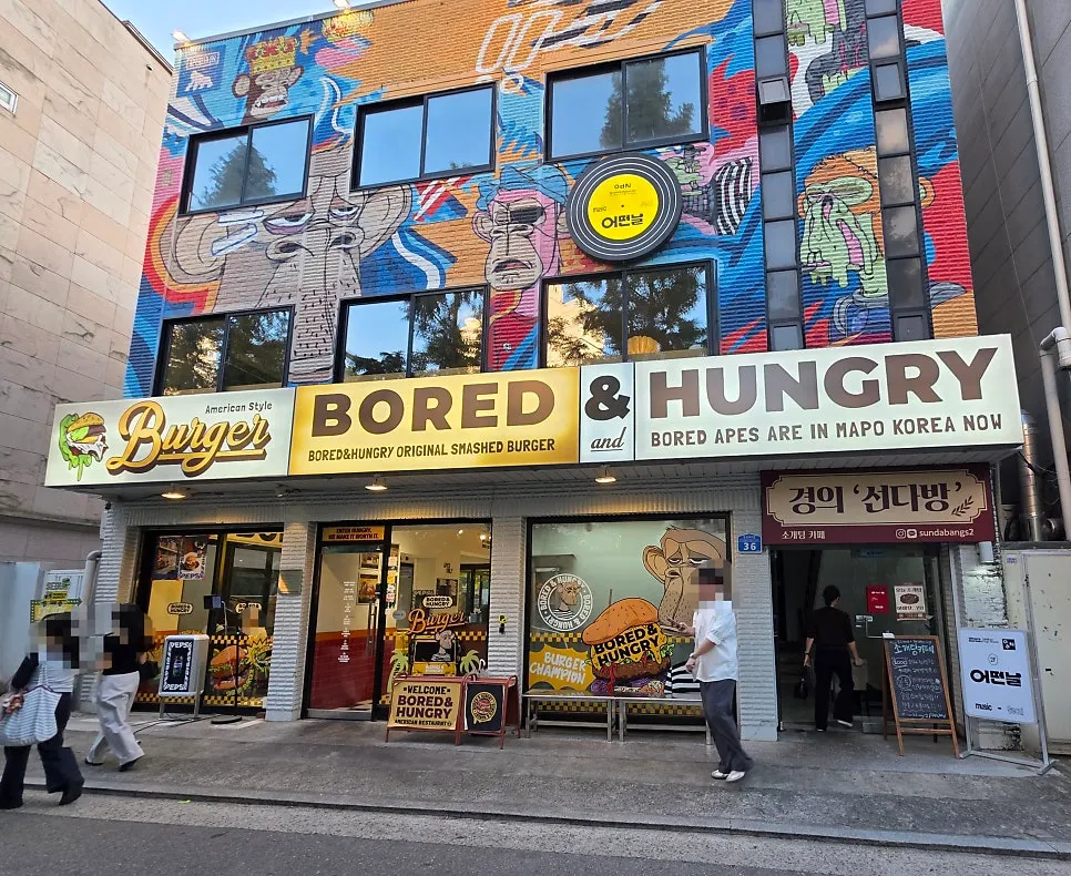 Bored & Hungry Mapo building exterior with the monkey character painted on it