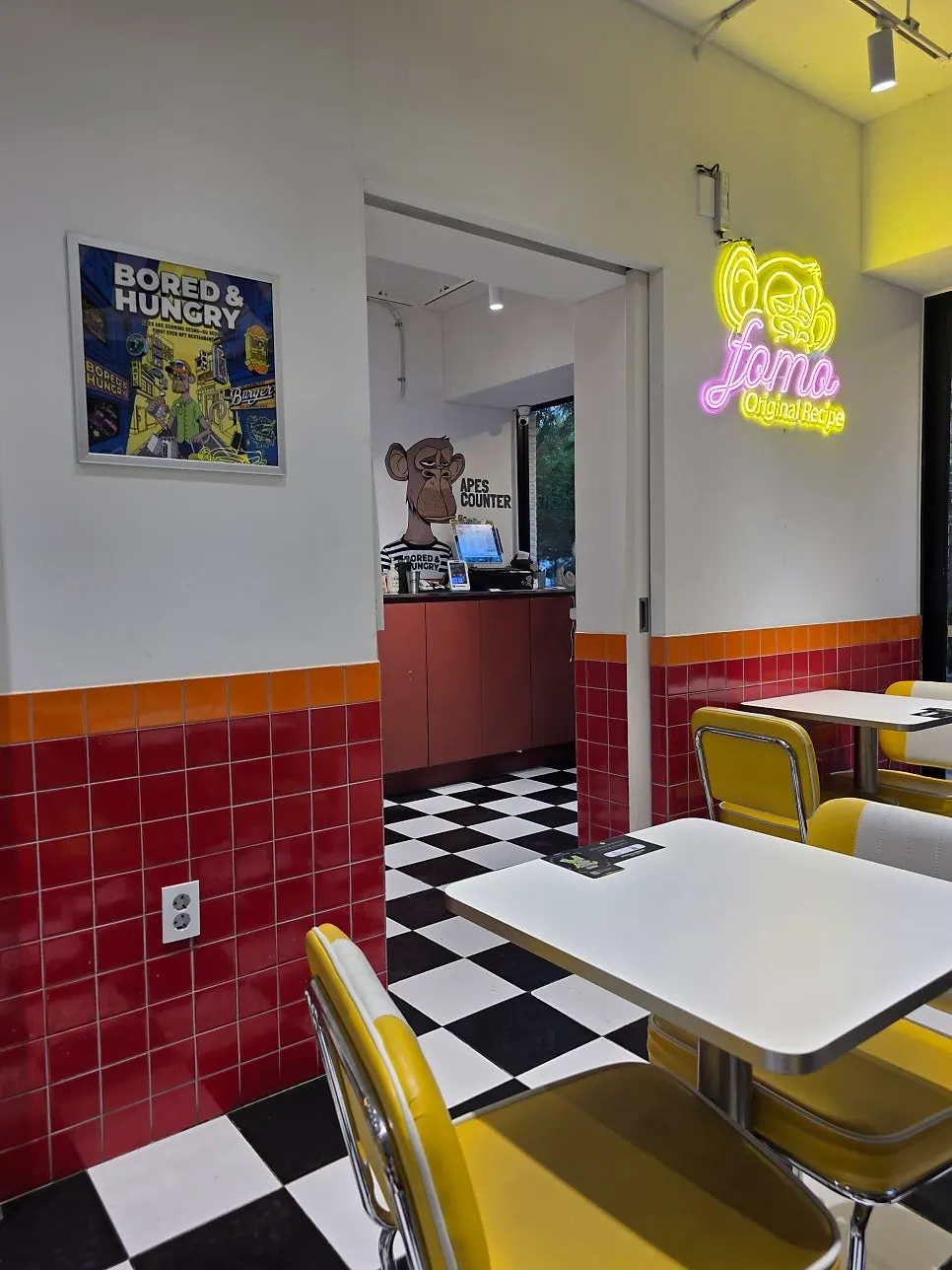 Interior with checkerboard floor and yellow chairs