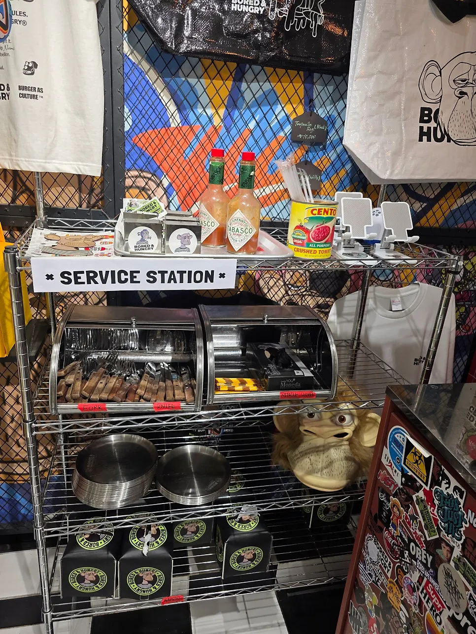 Self-serve corner with forks, wet wipes, and nitrile gloves