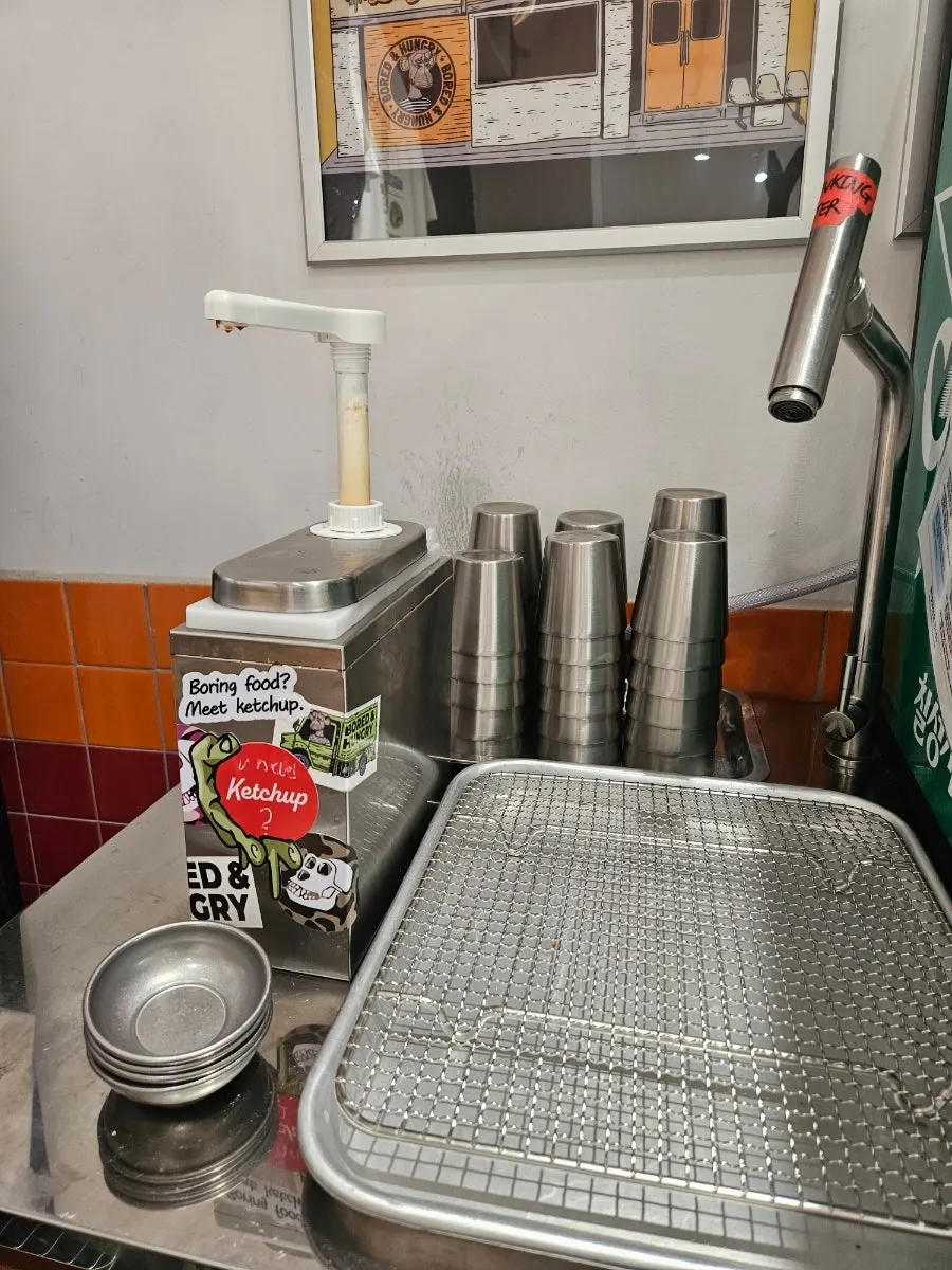 Nitrile gloves and ketchup stocked at the self-serve bar