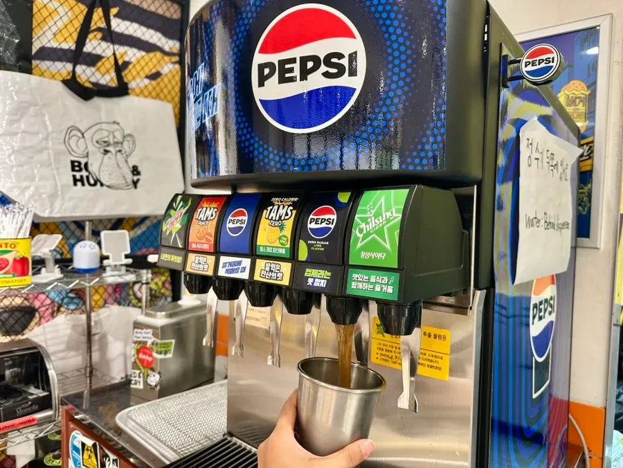 Self-serve bar with utensils and hygiene gloves for burgers