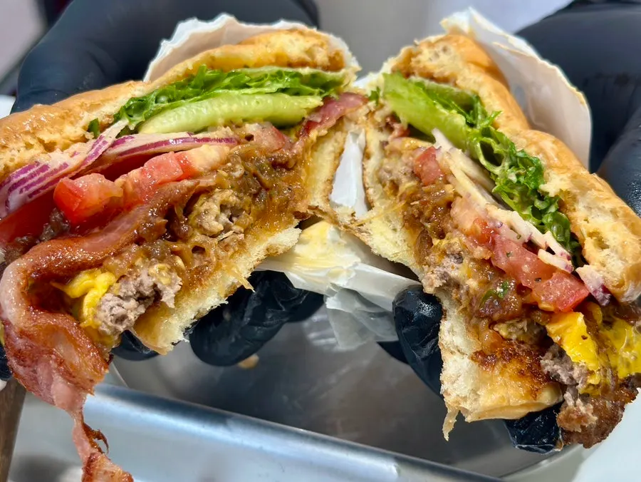 Cross-section of the patty topped with bacon
