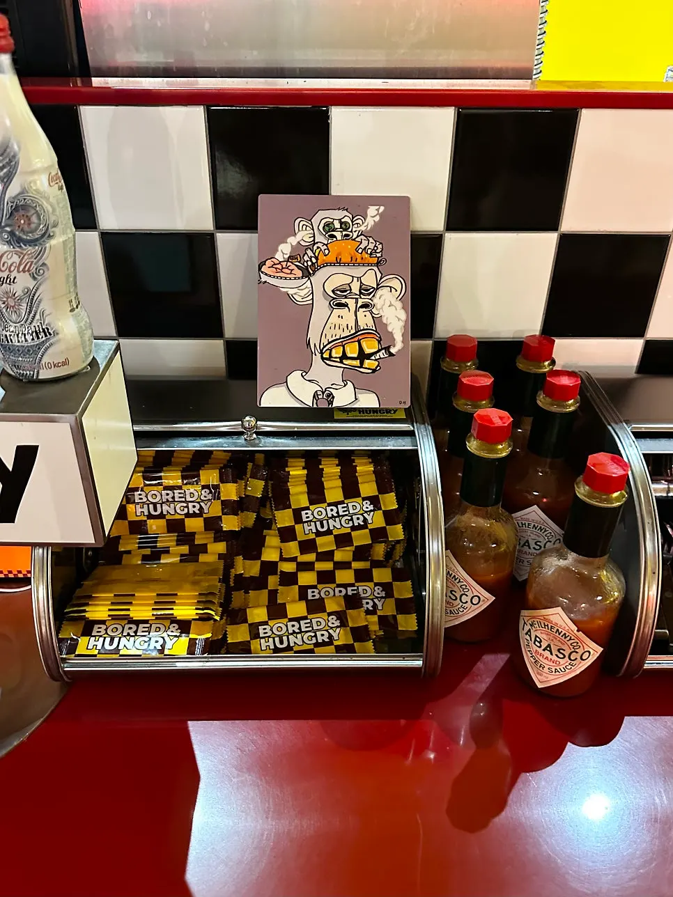 Self-serve zone with hot sauce and ketchup