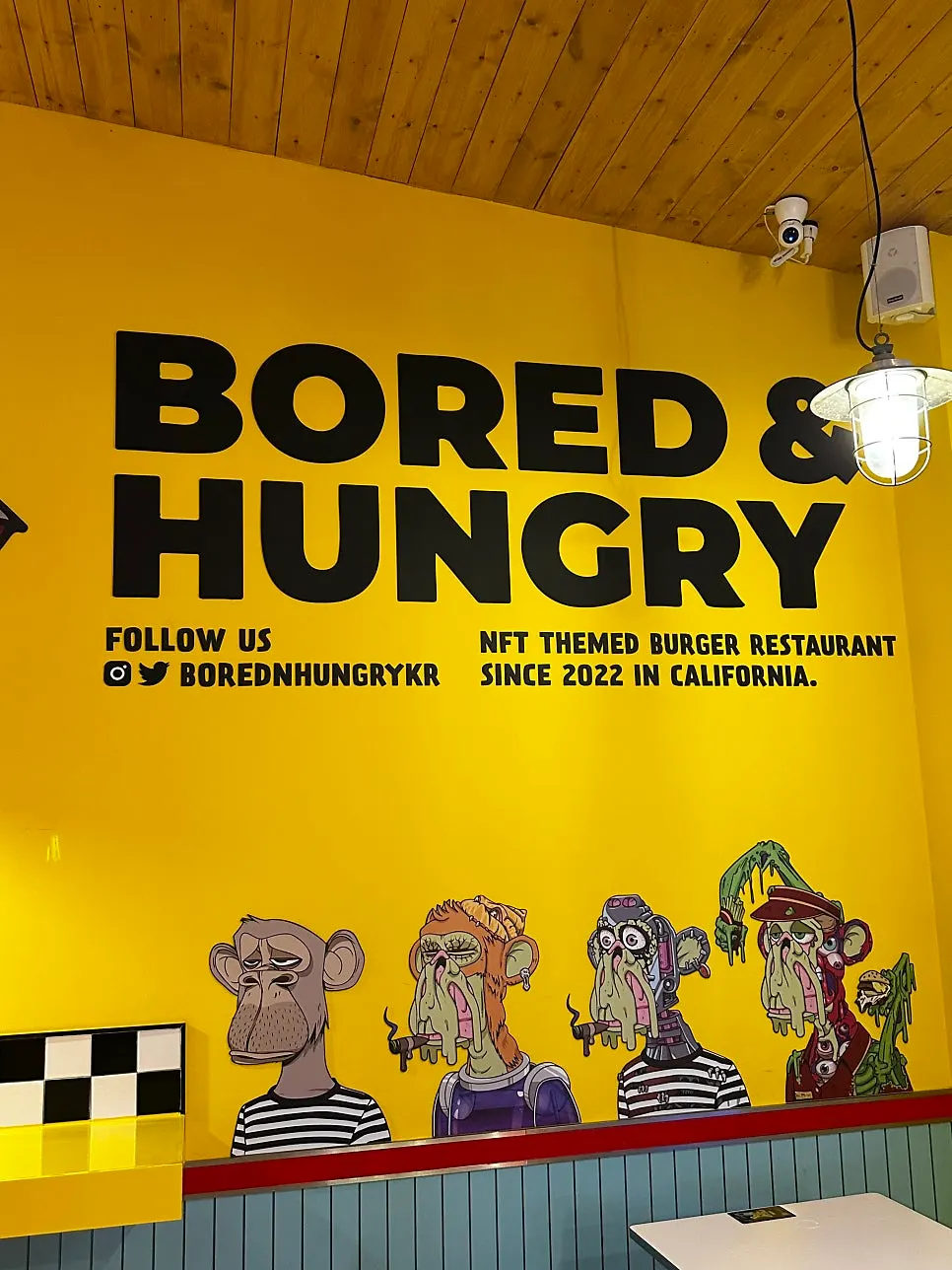 A corner of the restaurant decorated with wall graphics