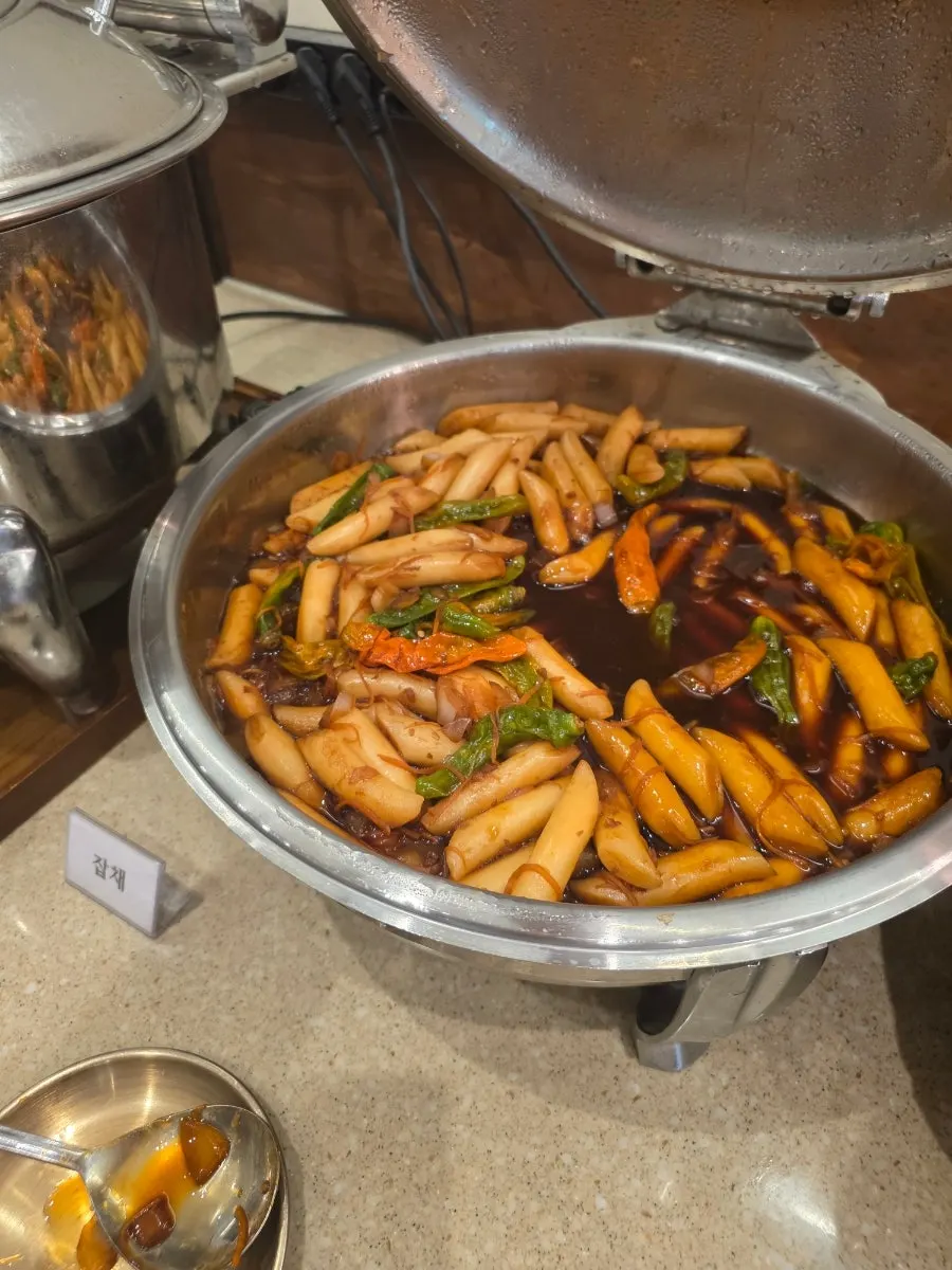 The corner of the self-bar with fried items and braised tofu
