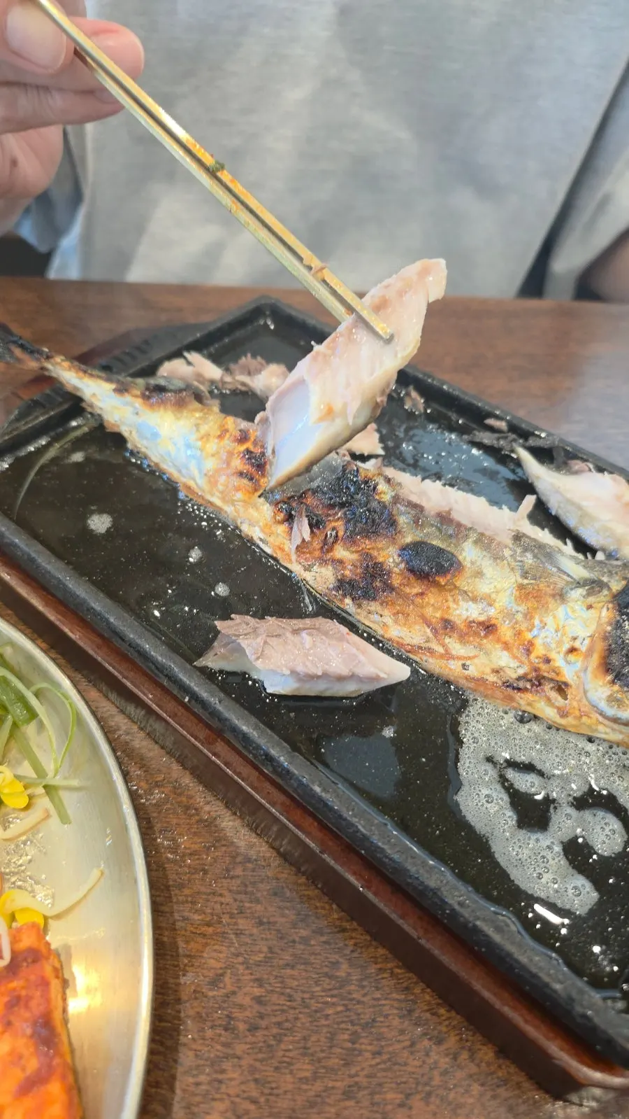 Grilled mackerel served as half a fish