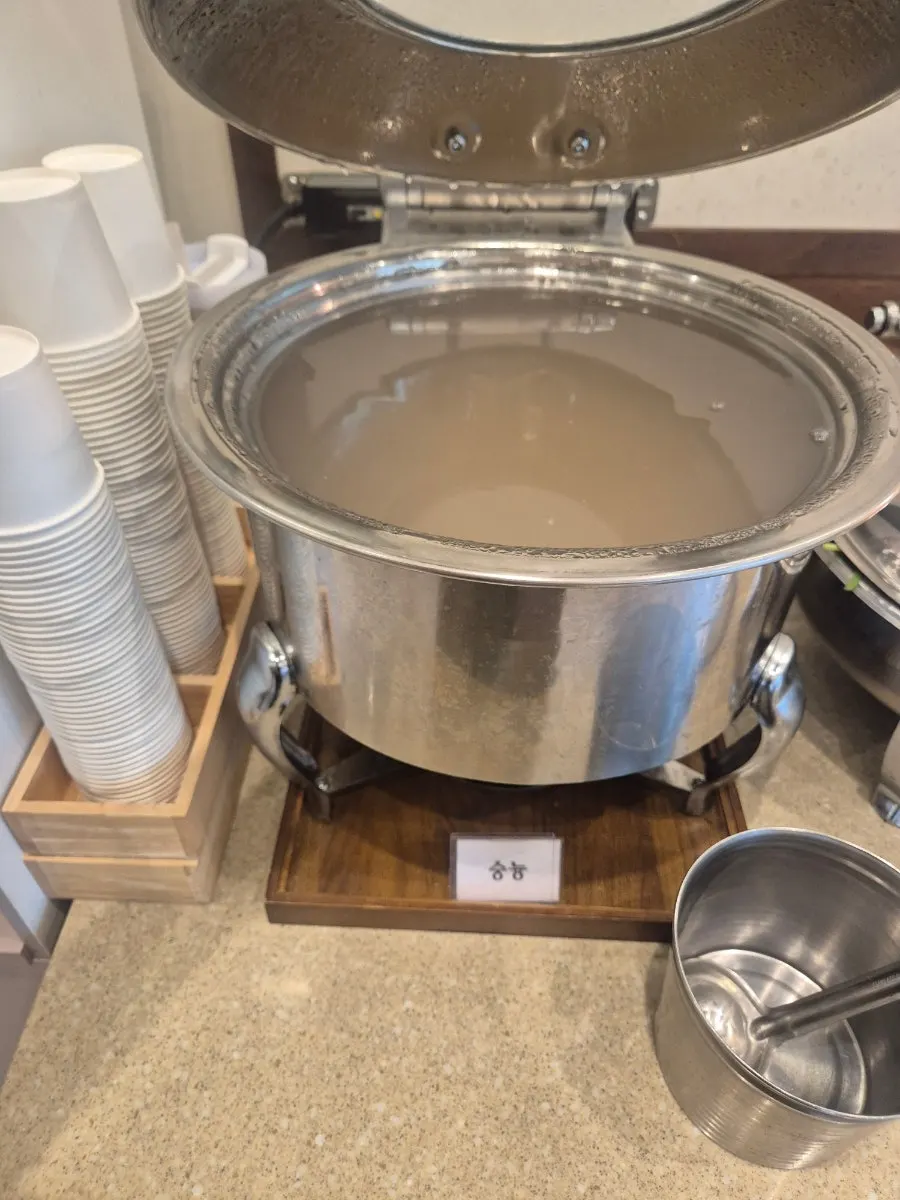 Namul and japchae set out at the self-serve bar