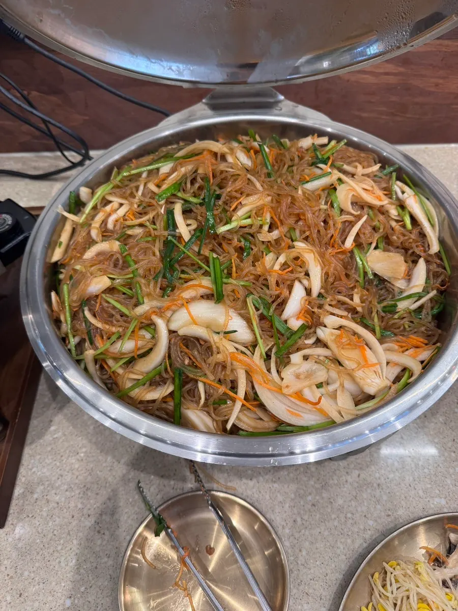 Japchae loaded with vegetables at the self-bar