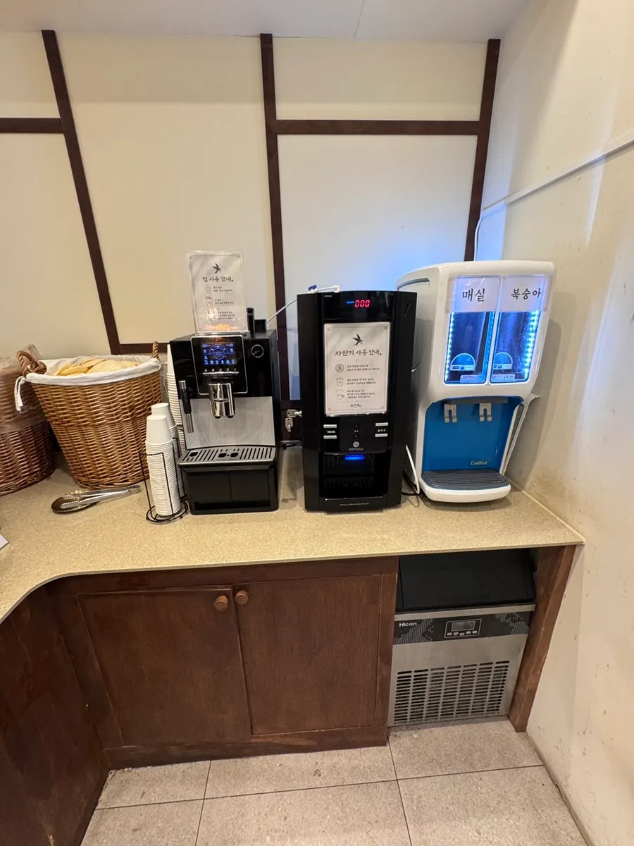 Drink station with plum, peach drinks, and coffee