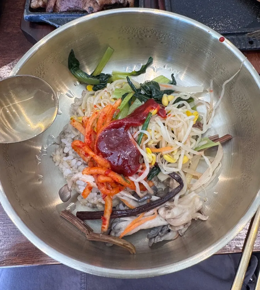 Barley bibimbap mixed with sesame oil and gochujang