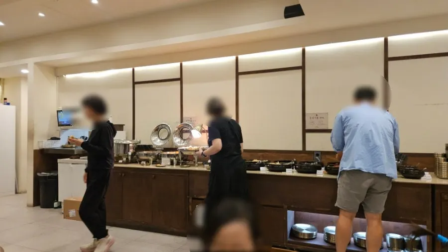 Buffet-style self-serve bar at Boriook lined with banchan