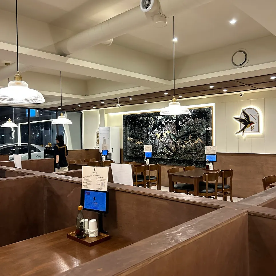 Widely spaced tables and seating at Boriook Main Branch