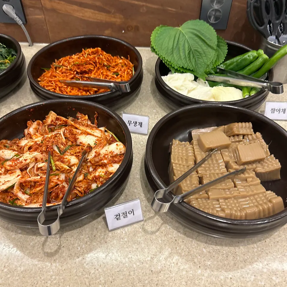 Self-serve bar at Boriook lined with namul and side dishes