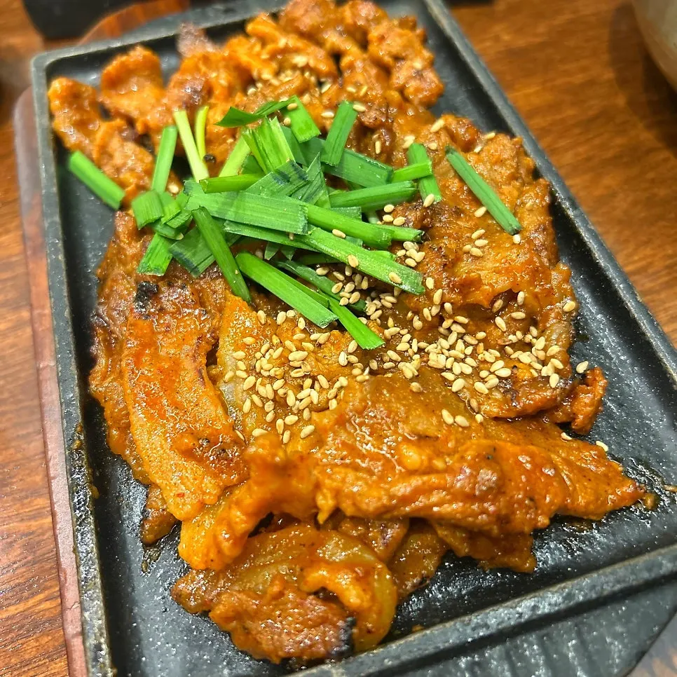 Gochujang pork topped with chives at Boriook
