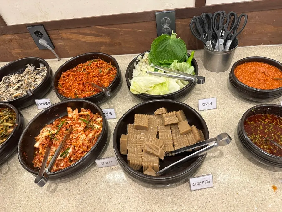 Various namul and side dishes at the self-serve bar