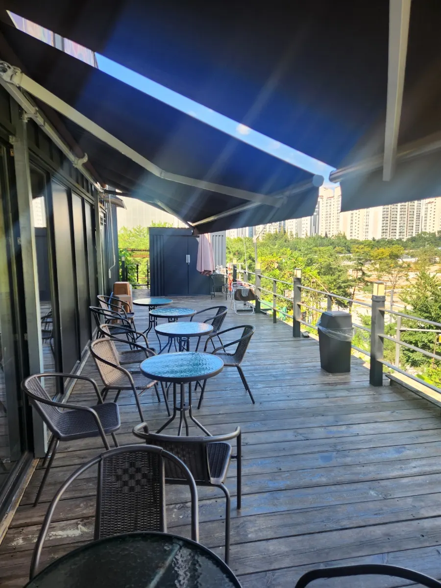 View of the terrace and outdoor scenery from an indoor window seat
