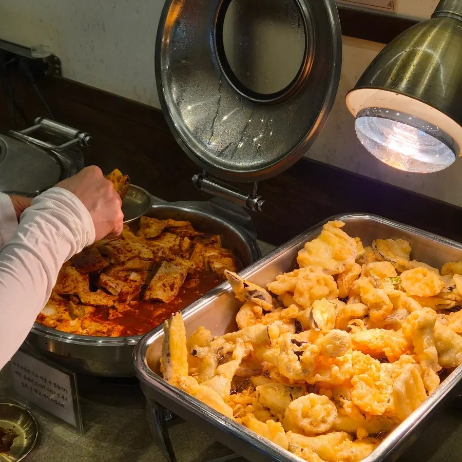 Side dish corner with pan-fried tofu and japchae