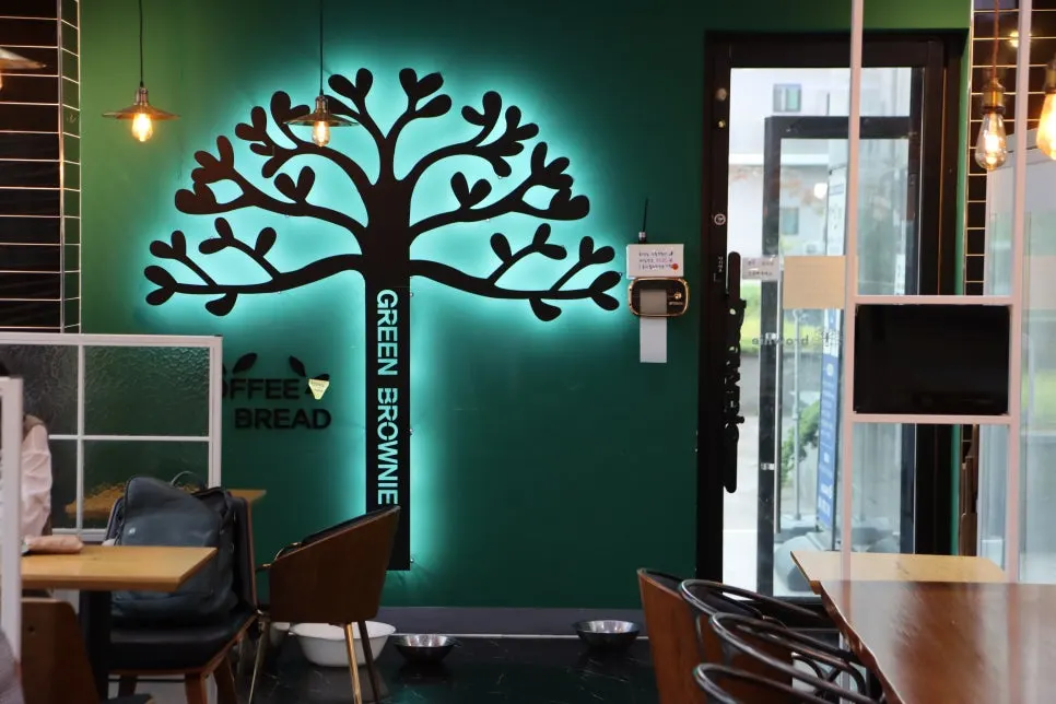 Store wall painted with green trees