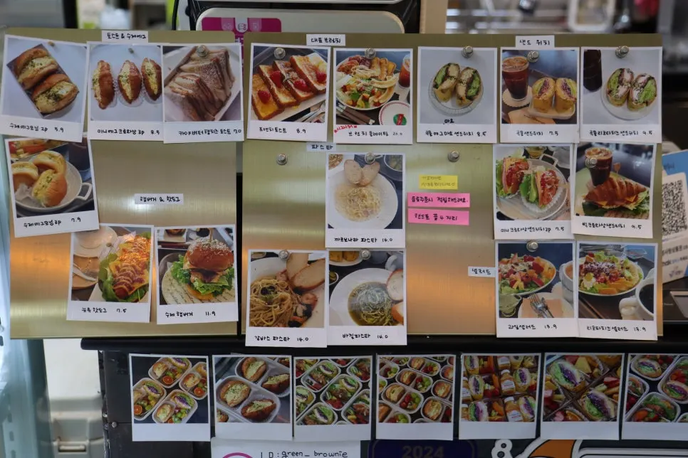 Sandwich menu photos hanging at the counter