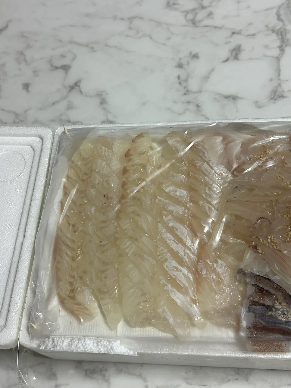 Flounder sashimi spread laid out at the accommodation