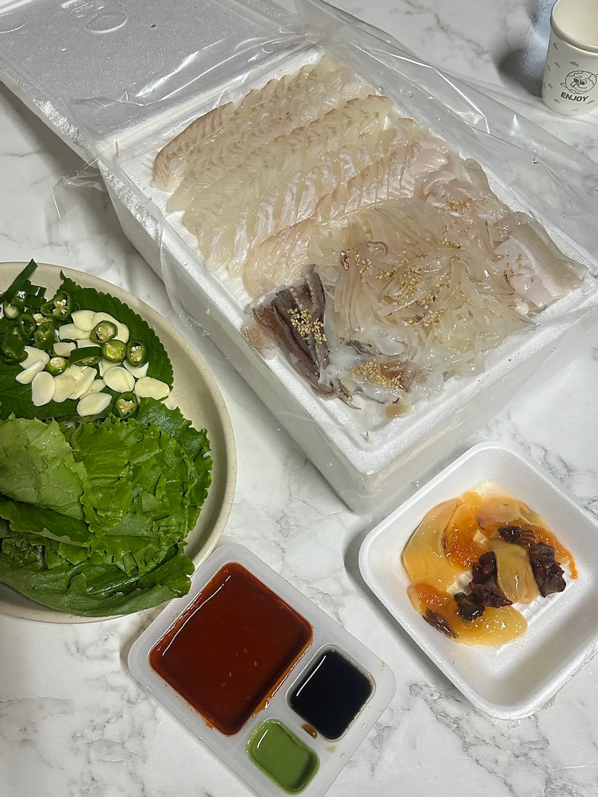 A piece of flounder sashimi eaten plain, without sauce