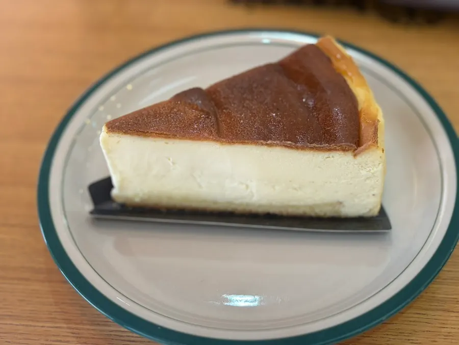Slice of golden-baked Basque cheesecake