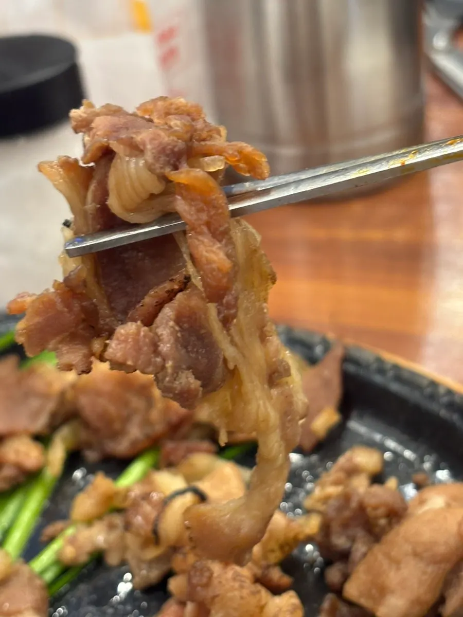 Table spread of gukbap paired with fire-grilled pork