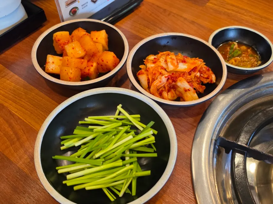 Basic side dishes: diced radish kimchi, cabbage kimchi, chives, and salted shrimp