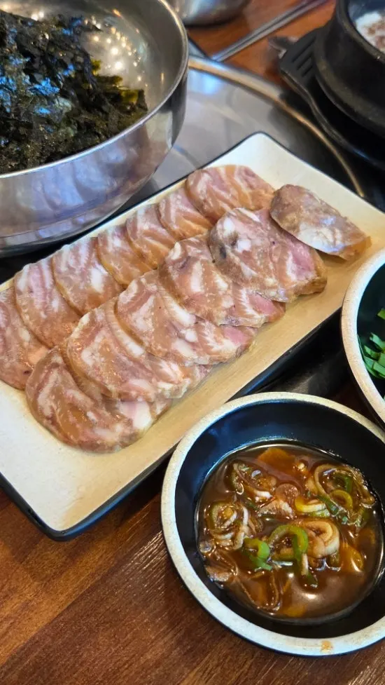 A plate of boiled pork slices ordered as a side
